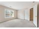 This bedroom features a large window, neutral paint, and a closet at 1740 Manhasset Pl, Atlanta, GA 30338