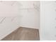 Walk-in closet with wire shelving and ample space for storage at 1740 Manhasset Pl, Atlanta, GA 30338