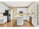 Well-lit kitchen with stainless steel appliances, island, and ample cabinet space at 1740 Manhasset Pl, Atlanta, GA 30338