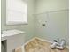 Functional laundry room with sink, storage, and hookups for washer and dryer at 1740 Manhasset Pl, Atlanta, GA 30338