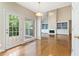 Open concept living room with fireplace, built-in shelving, and view to the backyard at 1740 Manhasset Pl, Atlanta, GA 30338