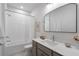 Bathroom offers a modern vanity, sleek fixtures, and a shower-tub combination for a relaxing experience at 200 Pinecone Pl, Alpharetta, GA 30022