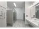 Commercial-style bathroom with multiple toilet stalls, dual sinks, and accessible fixtures at 200 Pinecone Pl, Alpharetta, GA 30022
