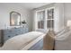 Bedroom filled with natural light, features a dresser, soft bedding, and calming decor for restful retreat at 200 Pinecone Pl, Alpharetta, GA 30022