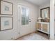 Bright entryway with a decorative cabinet, mirror, and sidelight door at 200 Pinecone Pl, Alpharetta, GA 30022