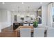 Eat-in kitchen with island seating, stainless appliances, ample counter space, and natural light at 200 Pinecone Pl, Alpharetta, GA 30022
