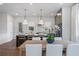 Modern kitchen featuring stainless steel appliances, pendant lighting, and hardwood floors at 200 Pinecone Pl, Alpharetta, GA 30022