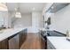 Bright kitchen featuring stainless steel appliances, white subway tile, quartz countertops, and modern pendant lighting at 200 Pinecone Pl, Alpharetta, GA 30022