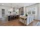Eat-in kitchen with island seating, stainless appliances, ample counter space, and natural light at 200 Pinecone Pl, Alpharetta, GA 30022