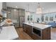 Spacious kitchen island with modern appliances, ample counter space, and comfortable seating area at 200 Pinecone Pl, Alpharetta, GA 30022