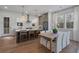 Bright kitchen with stainless steel appliances, stylish bar stools, and hardwood floors at 200 Pinecone Pl, Alpharetta, GA 30022