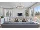 Bright living room featuring modern lighting and a comfortable seating area with natural light at 200 Pinecone Pl, Alpharetta, GA 30022