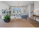 Open-concept living space with hardwood floors and staircase, blending kitchen, dining, and living areas at 200 Pinecone Pl, Alpharetta, GA 30022