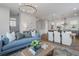 Open-concept living space with hardwood floors, seamlessly blending kitchen, dining, and living areas at 200 Pinecone Pl, Alpharetta, GA 30022