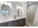 Modern main bathroom with double vanity, mirrors and glass walk-in shower at 200 Pinecone Pl, Alpharetta, GA 30022