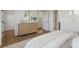 Bright main bedroom featuring a dresser, closet and light wood floors at 200 Pinecone Pl, Alpharetta, GA 30022
