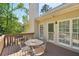 Back deck with metal table and chairs overlooking backyard at 2545 Amberbrook Ln, Grayson, GA 30017