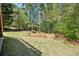 Expansive backyard featuring mature trees that provide plenty of privacy, and lush green grass at 2545 Amberbrook Ln, Grayson, GA 30017