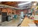 Basement with workbench, garage sale items, and exposed ceiling at 2545 Amberbrook Ln, Grayson, GA 30017