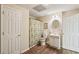 Well-lit bathroom with wood floors, vanity, shower/tub, and a closed door at 2545 Amberbrook Ln, Grayson, GA 30017