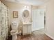 Bathroom features wood-look flooring, a standard toilet and vanity, and a shower/tub combo with patterned curtain at 2545 Amberbrook Ln, Grayson, GA 30017