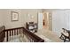 Bedroom featuring a crib, changing table, rocking chair, and view to another room at 2545 Amberbrook Ln, Grayson, GA 30017
