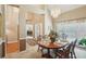 Traditional dining room with chandeliers and set table at 2545 Amberbrook Ln, Grayson, GA 30017