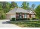 Well maintained brick and vinyl home with green shutters and manicured front yard at 2545 Amberbrook Ln, Grayson, GA 30017