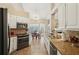 Modern kitchen featuring granite countertops, stainless steel appliances, and ample cabinet space at 2545 Amberbrook Ln, Grayson, GA 30017