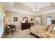 Spacious main bedroom with tray ceiling and neutral colors at 2545 Amberbrook Ln, Grayson, GA 30017