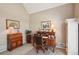 Home office featuring a wooden desk, vaulted ceilings, and natural light at 2545 Amberbrook Ln, Grayson, GA 30017