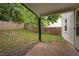 A portion of the backyard of this house featuring grass, a wood fence, and a concrete patio at 2896 Lakemont Sw Dr, Marietta, GA 30060