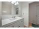 Bright bathroom with a sleek white vanity, modern faucet, and a large mirror, offering a fresh and clean aesthetic at 2896 Lakemont Sw Dr, Marietta, GA 30060