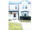 Charming home featuring clean white siding, black trim, and well-kept front yard at 2896 Lakemont Sw Dr, Marietta, GA 30060