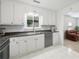 Clean, bright kitchen with white cabinets, subway tile backsplash, and stainless steel appliances at 2896 Lakemont Sw Dr, Marietta, GA 30060