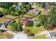 Aerial view of a home with mature trees, a deck, and a hot tub at 65 Woodside Ct, Mcdonough, GA 30253