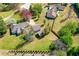 Aerial view of a home with a large yard, detached garage, and mature trees at 65 Woodside Ct, Mcdonough, GA 30253