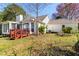 Back exterior of home with a wood deck at 65 Woodside Ct, Mcdonough, GA 30253