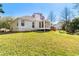 Back exterior of home with a screened porch at 65 Woodside Ct, Mcdonough, GA 30253