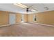Large bonus room with neutral carpet and paint at 65 Woodside Ct, Mcdonough, GA 30253