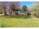 Charming home with well-maintained lawn and mature trees at 65 Woodside Ct, Mcdonough, GA 30253