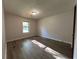This bedroom features wood floors, a window, and natural light at 1228 Reilly Ln, Clarkston, GA 30021