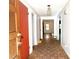 Inviting hallway featuring wood-look floors, neutral walls, and natural light from nearby rooms at 1228 Reilly Ln, Clarkston, GA 30021