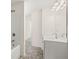 This bathroom features a bathtub and a vanity with a sink and faucet at 13579 Whitman Ln, Covington, GA 30014
