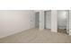 This bedroom features neutral carpet, two closets and an ensuite bathroom at 13579 Whitman Ln, Covington, GA 30014