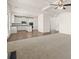 Spacious living area showcasing recessed lighting, carpet and hard wood floors, and open access to the modern kitchen at 13579 Whitman Ln, Covington, GA 30014