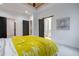 This bedroom features a sliding barn door to a bathroom, as well as dark doors to the walk in closet at 2323 Mason Dr # D21, Atlanta, GA 30316