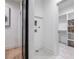 Hallway area featuring geometric tile, a laundry hookup area, as well as access to the walk-in closet at 2323 Mason Dr # D21, Atlanta, GA 30316