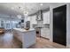 Bright kitchen with an island, stainless steel appliances, quartz countertops, and modern pendant lighting at 2323 Mason Dr # D21, Atlanta, GA 30316