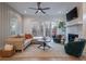 Bright living room with a ceiling fan, comfortable seating, fireplace and sliding doors to the balcony at 2323 Mason Dr # D21, Atlanta, GA 30316